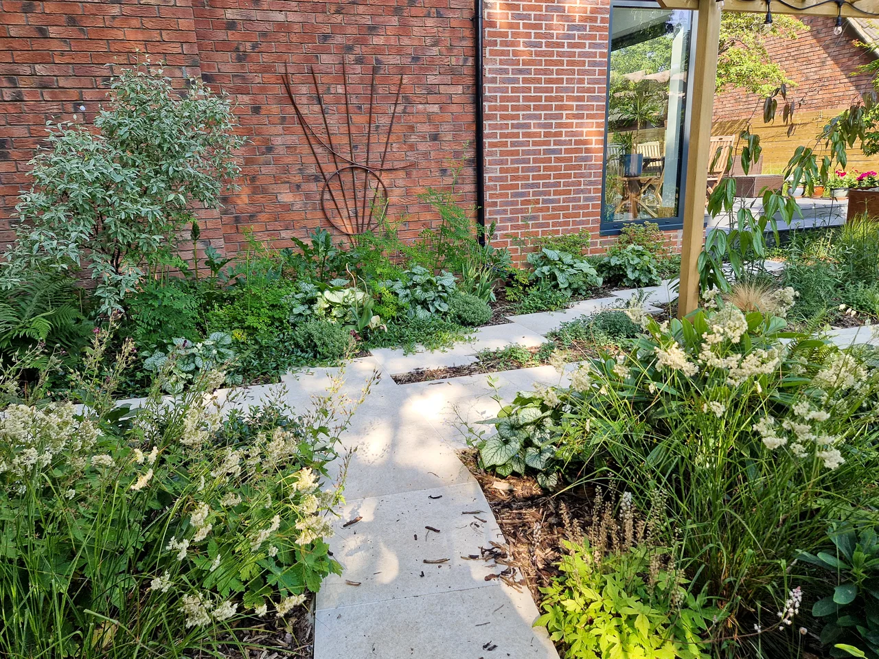 Contemporary garden design - Garden paths leading through shade-tolerant planting in Alwoodley. Yorkshire Gardens, Leeds